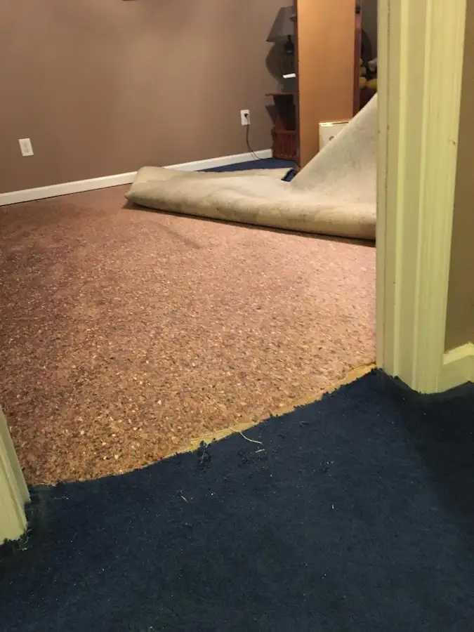 Carpet pad removal revealing water damage during Water Mitigation Services in Red Bluff