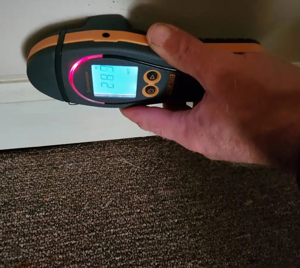 Moisture detection at baseboard during Storm Damage Restoration in Red Bluff
